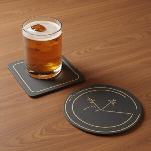 A glass of amber beer with white foam on a coaster on a wooden table.